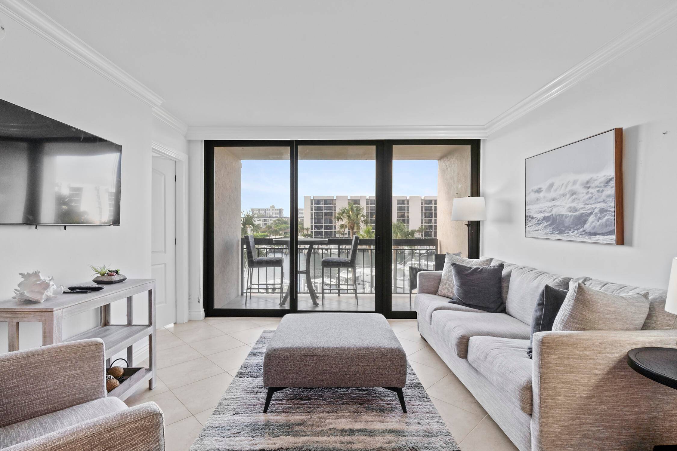 Sweeping Southern Marina Views from this Neutral Tile Two Bedroom, Two Bathroom Unit, Updated Granite Kitchen w Glass Subway Tile Backsplash, White Custom Cabinets, SS GE Appliances, Crown Molding Throughout, ...
