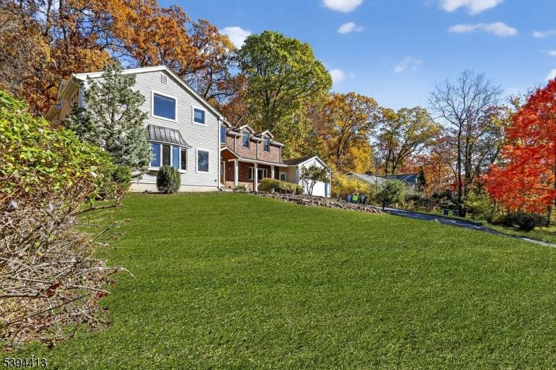 Nestled in a peaceful, private setting with breathtaking mountain views, this expanded 5 bedroom, 3 bath and 2 half baths colonial blends classic charm with modern updates.