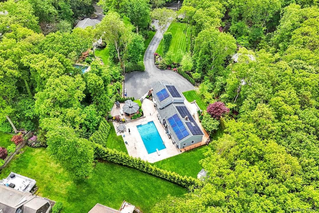 Perched atop a beautifully manicured acre in the Harborfields School District, 69 Bankside Drive welcomes you from the moment you pull in.