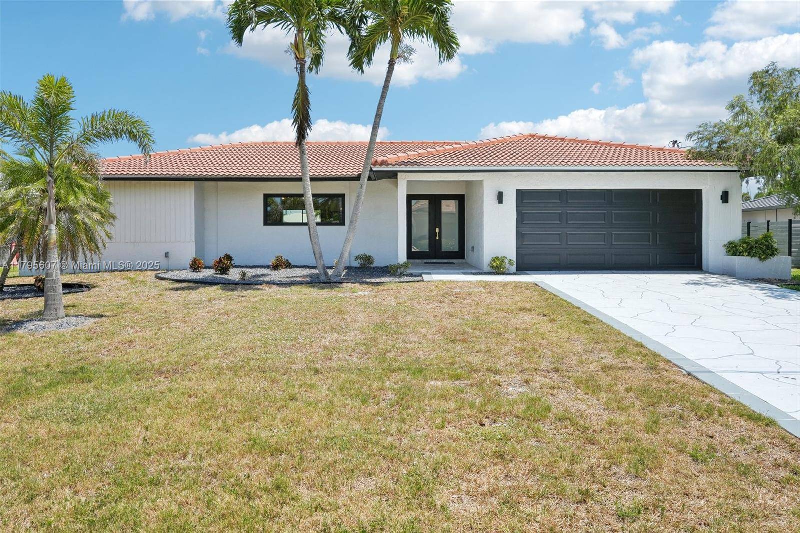 Welcome to this stunning 3 bedroom den, 3 bath home in SW Cape Coral with direct Gulf access, canal views, and turnkey style.