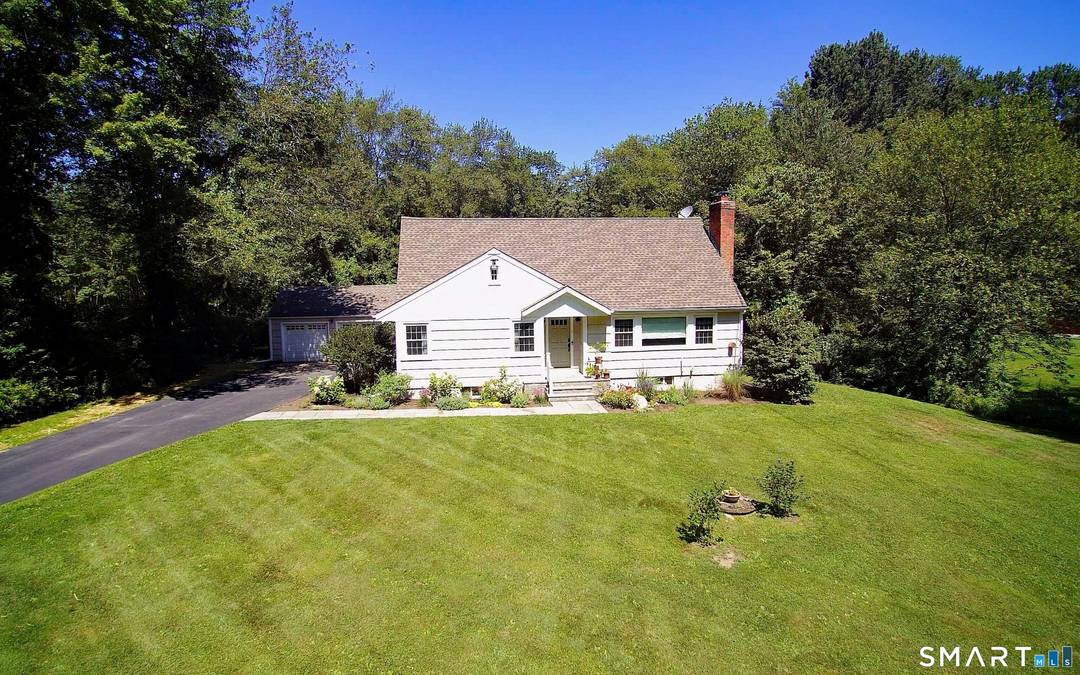 Idyllic country cape on picture perfect level lot, set back privately with fenced in backyard, new spacious deck for entertaining, plus built in wading pool for summer fun.