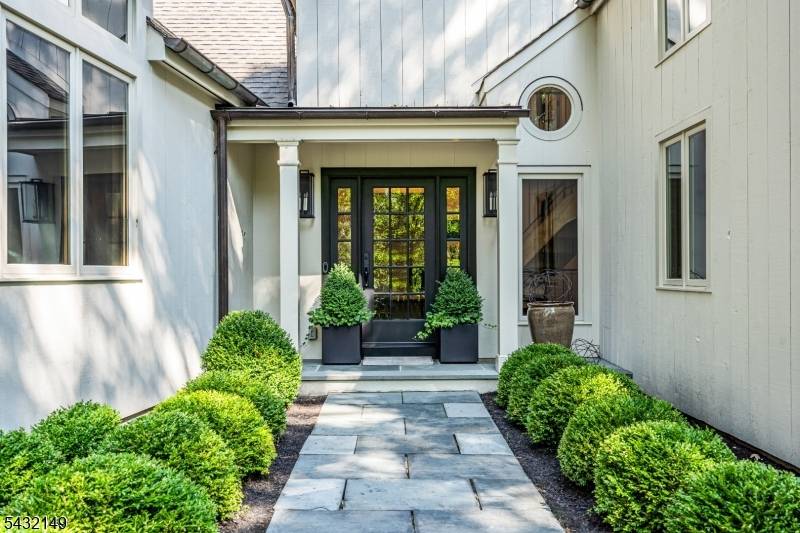 Set on beautifully landscaped grounds overlooking Bedens Brook Country Club, this distinctive residence blends thoughtful design, unique architecture, and exceptional indoor outdoor living.