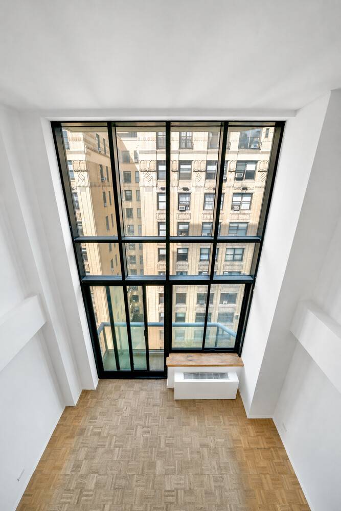 Loft like 1 bedroom, 1. 5 bath duplex with 17 foot double height ceilings in a full service condop co op with condo rules in the heart of the Upper ...