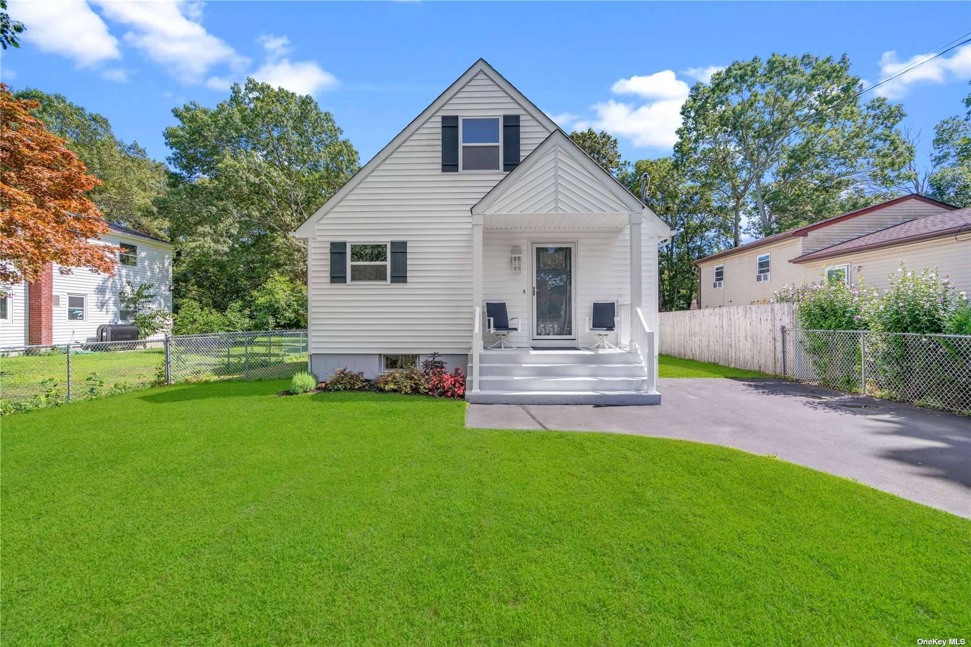 Stunning 4 bed, 2 full bath in line Cape with front portico, long driveway and large fenced in yard.
