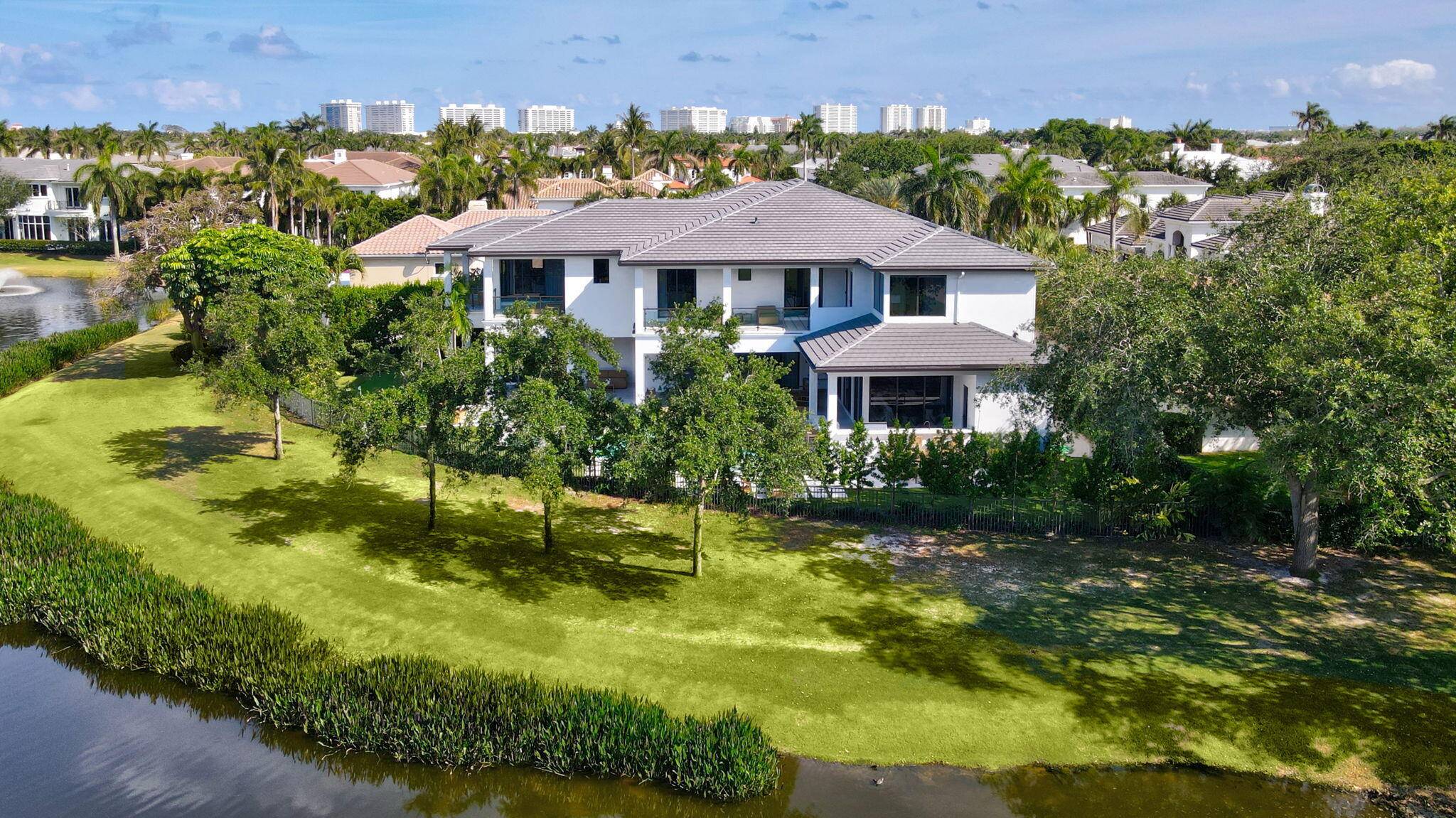 Brand New Modern Golf Lakefront Estate built by Primo Construction, architecture by Cosentino Architecture, designed by Arianna Tascione Aly Daily furnishings.