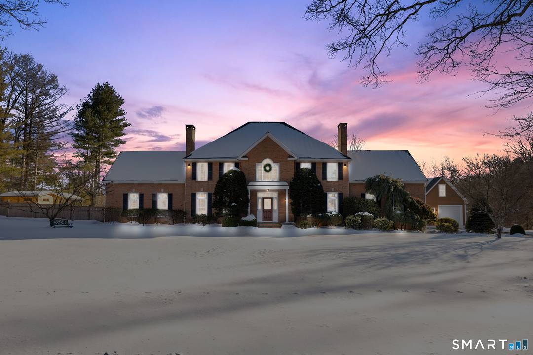 This stately Colonial tucked away at the end of a cul de sac in Easton, blends classic architecture with resort style living.