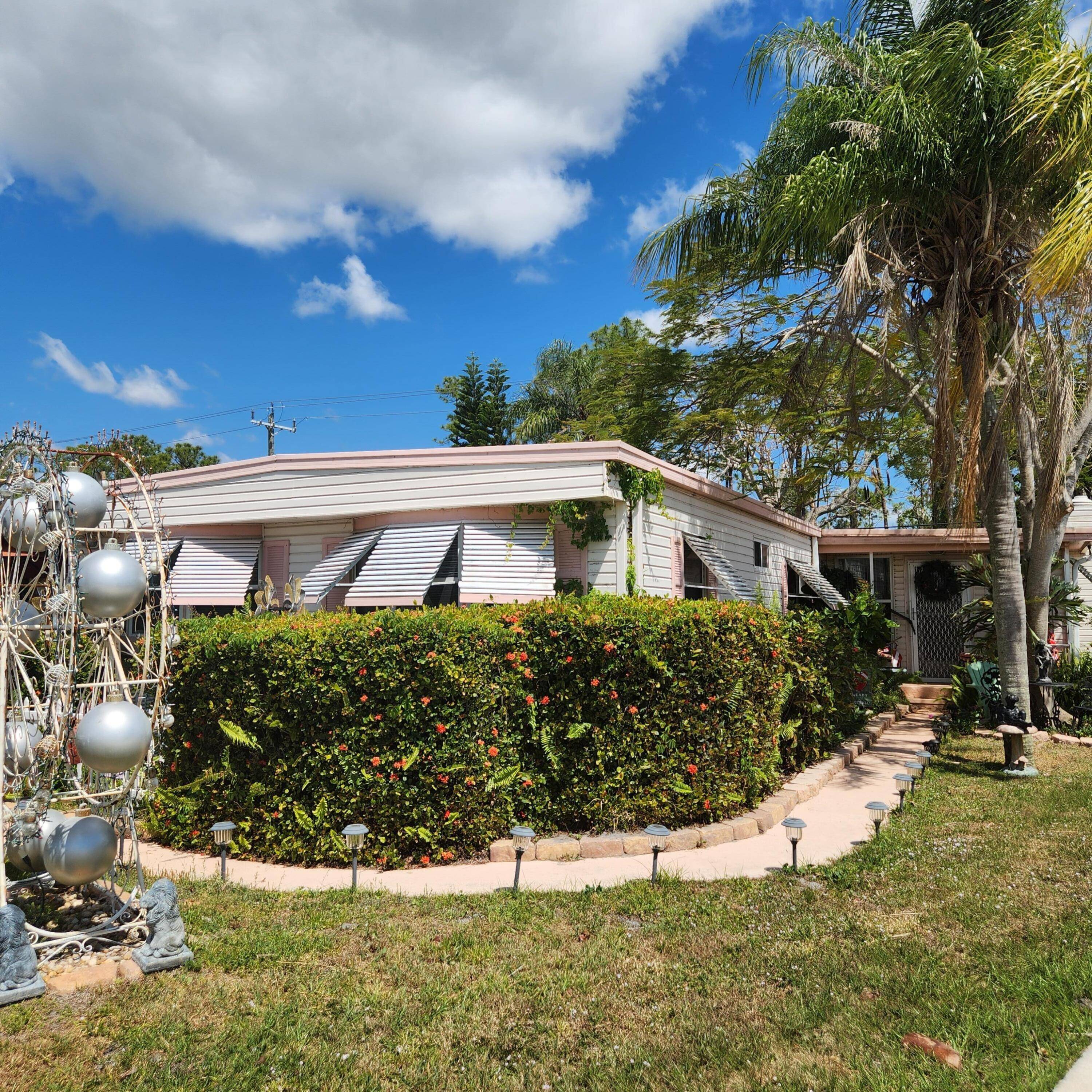 Welcome to your large HANDYMAN SPECIAL, 3 bedroom 2 bath, with a living room, formal dining, cafe dining, parlor, Florida room !