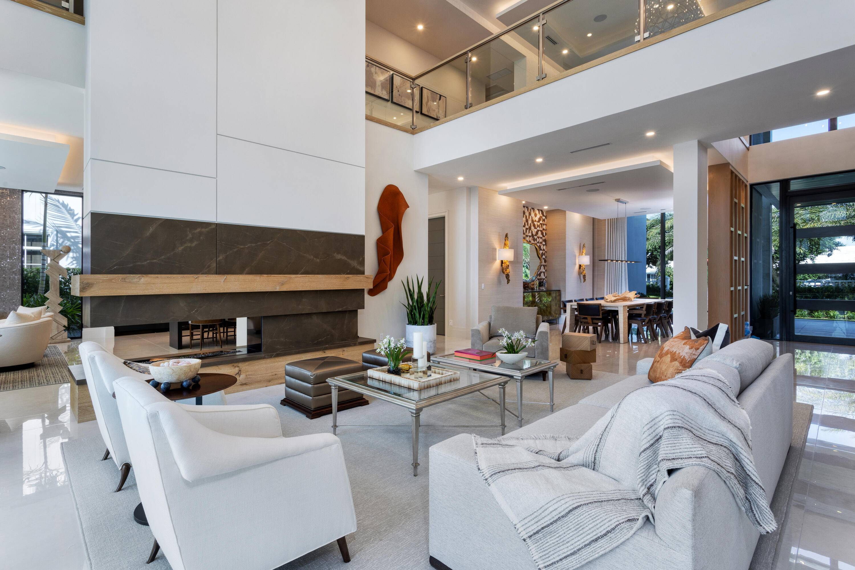 Quietly tucked away in the illustrious Royal Palm Yacht and Country Club, this exquisite newly constructed estate is fully furnished by award winning designer Lesly Maxwell Interiors.