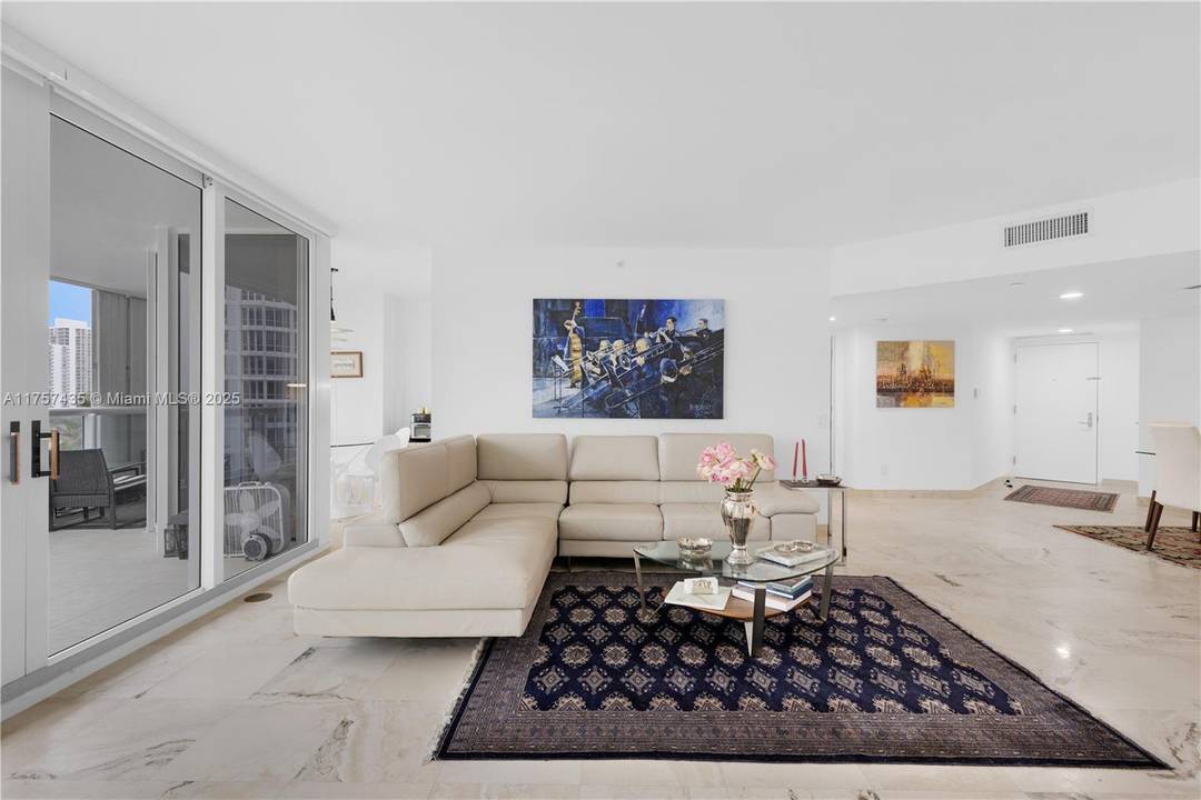 BEAUTIFUL 3 BEDROOM 2 BATH OR 2 DEN CORNER UNIT IN ONE OF THE BEST BUILDINGS IN AVENTURA.