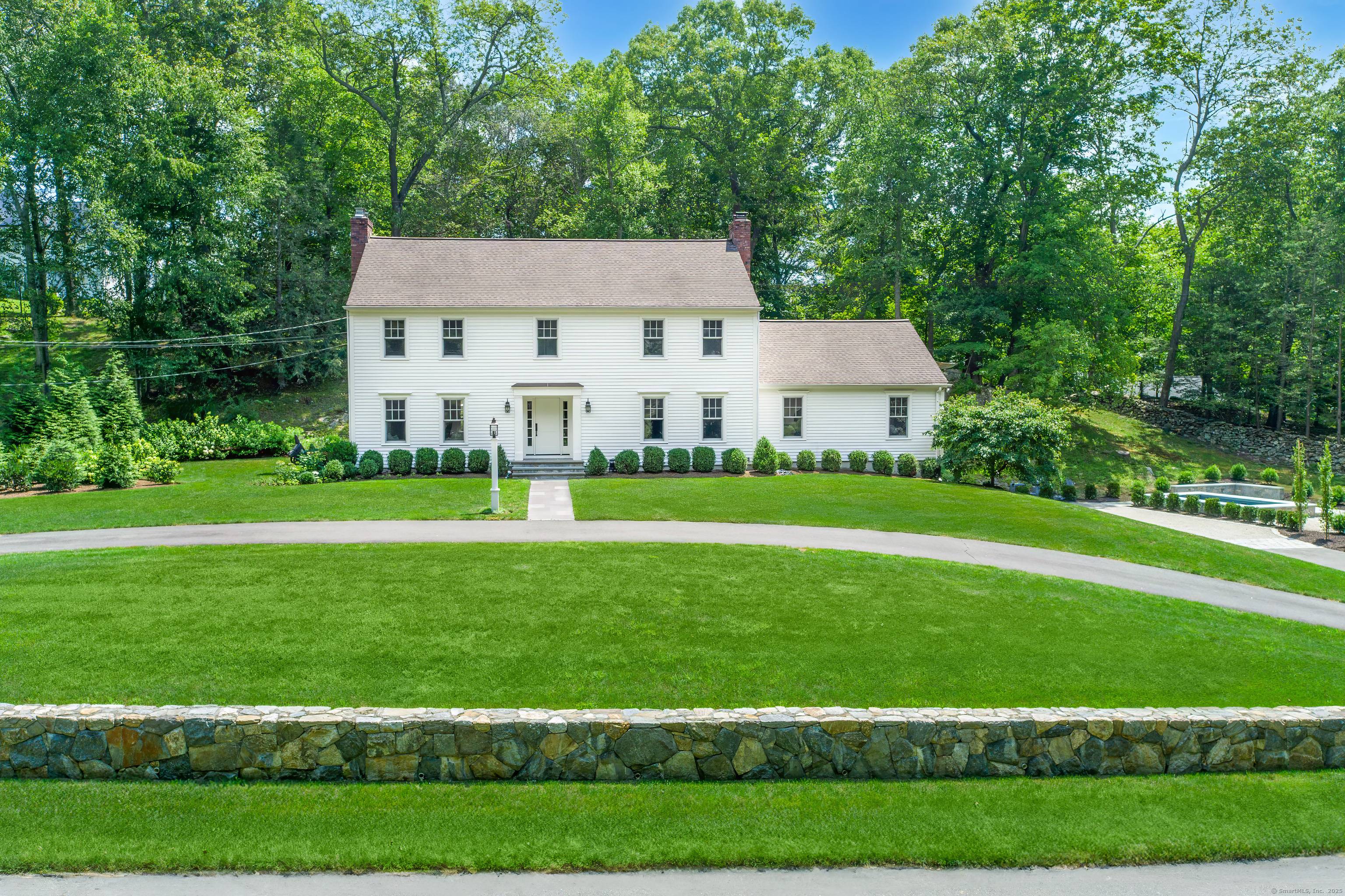 Welcome to this meticulously, well designed Connecticut Colonial beautifully sited on one of SW Ridgefield's most desirable cul de sacs.