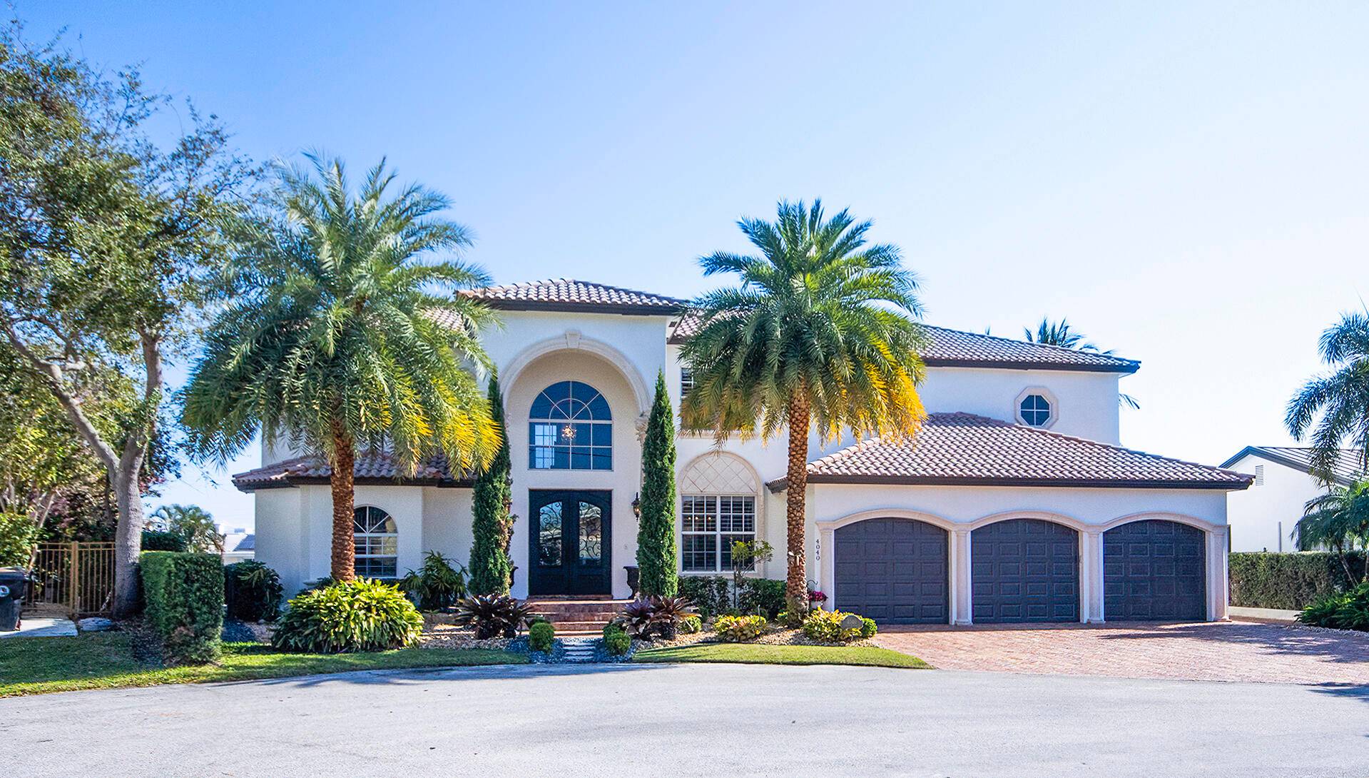 Elegant Mediterranean Inspired, Eastern exposure Deepwater Estate with 119' of new dockage reinforced sea wall on the Bravo canal.