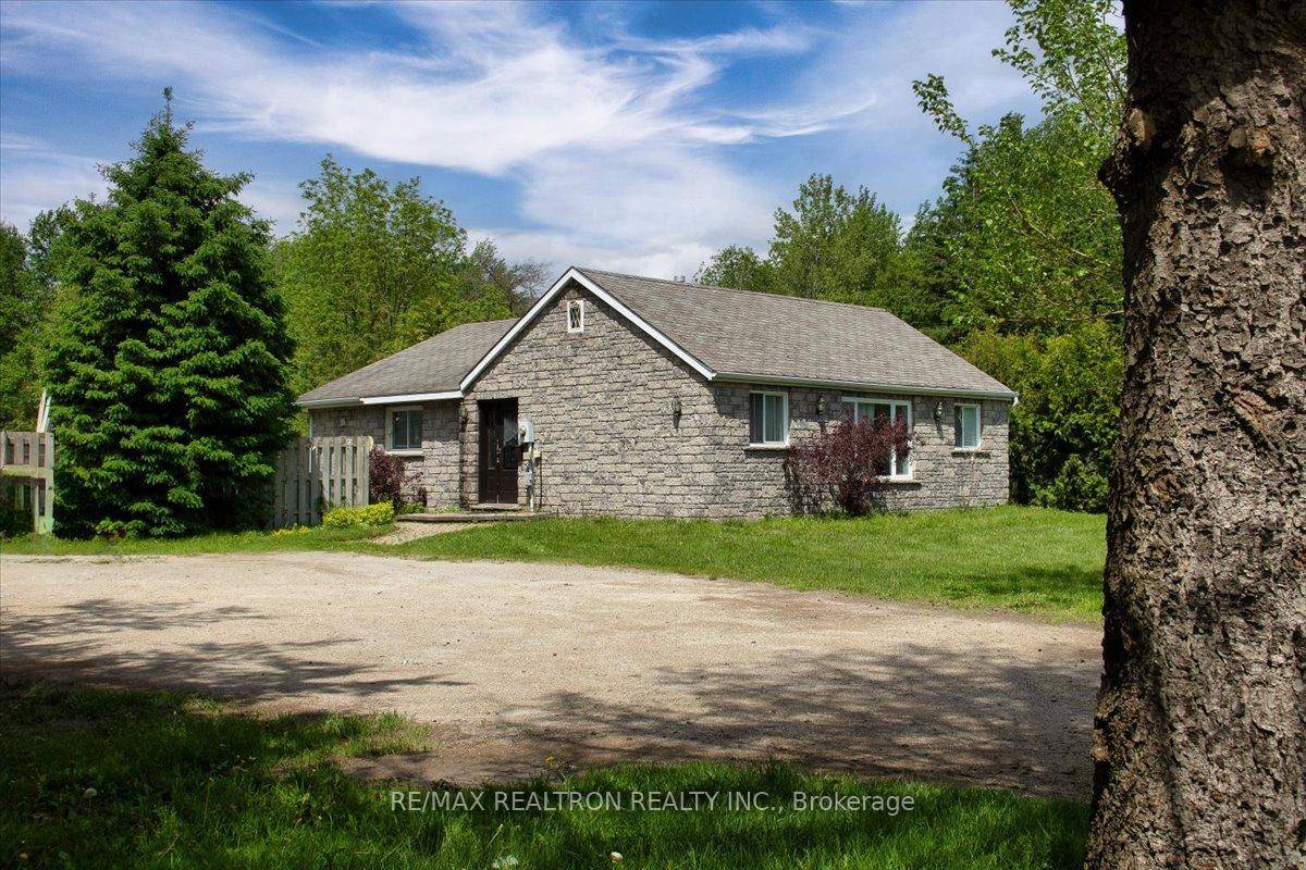 Absolutely Charming Bungalow Nestled On 1 Acre of Land In Prime Location !