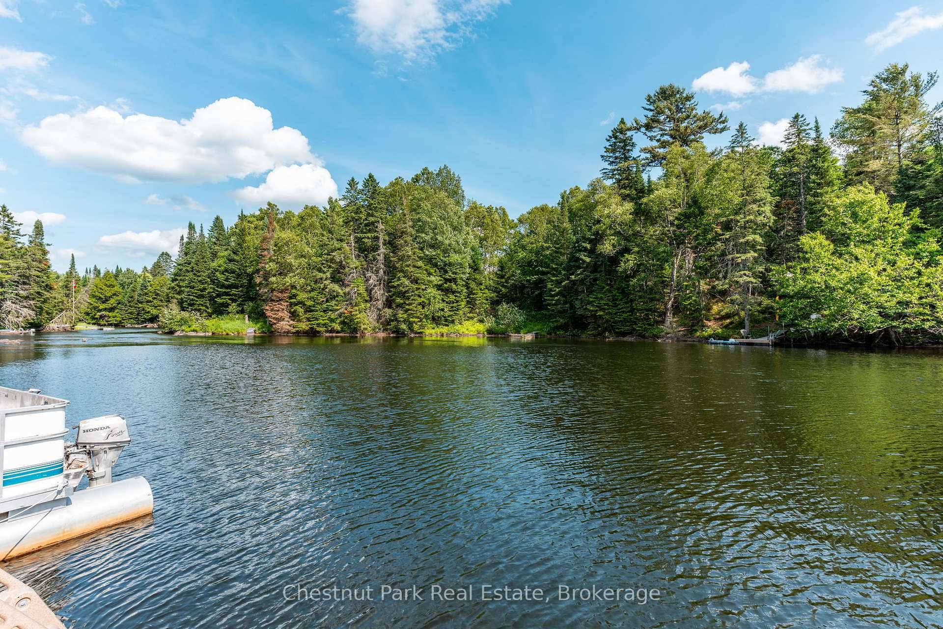 Escape to this serene waterfront property on the Gull River, offering access to Maple, Grass, and Pine Lakes.