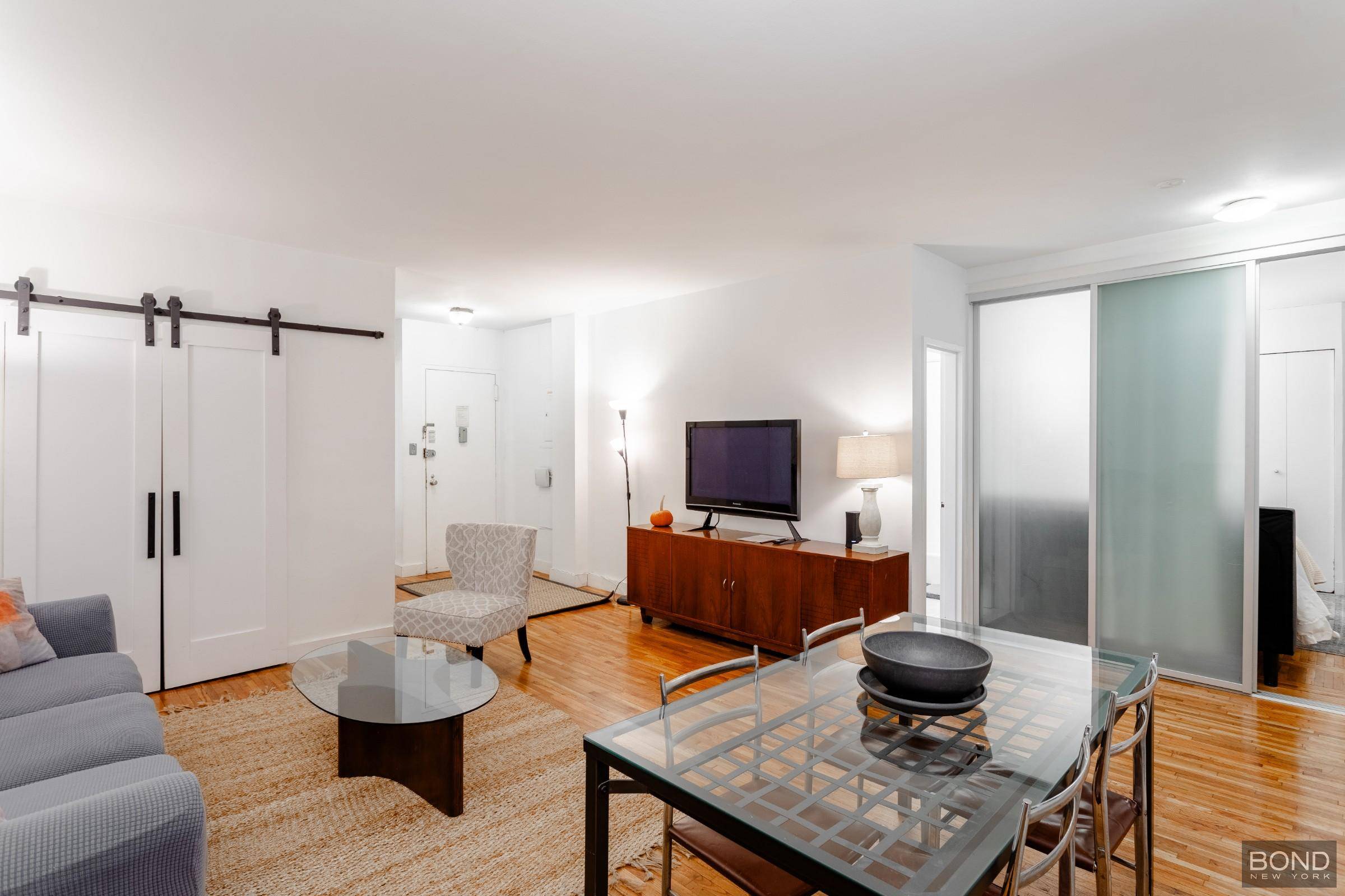 This fully furnished two bedroom, one bathroom apartment offers a spacious living room with high ceilings and gleaming hardwood floors throughout.