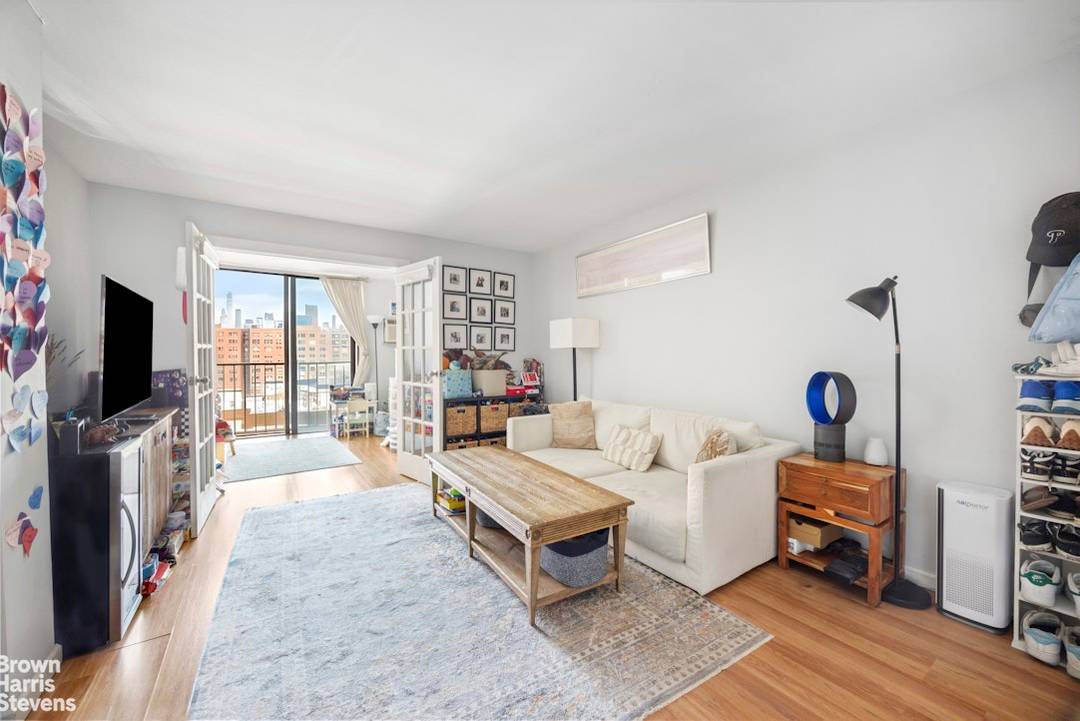 Residence 721 at Penny Lane is a bright and flexible one bedroom simplex, currently configured as a two bedroom with French doors.