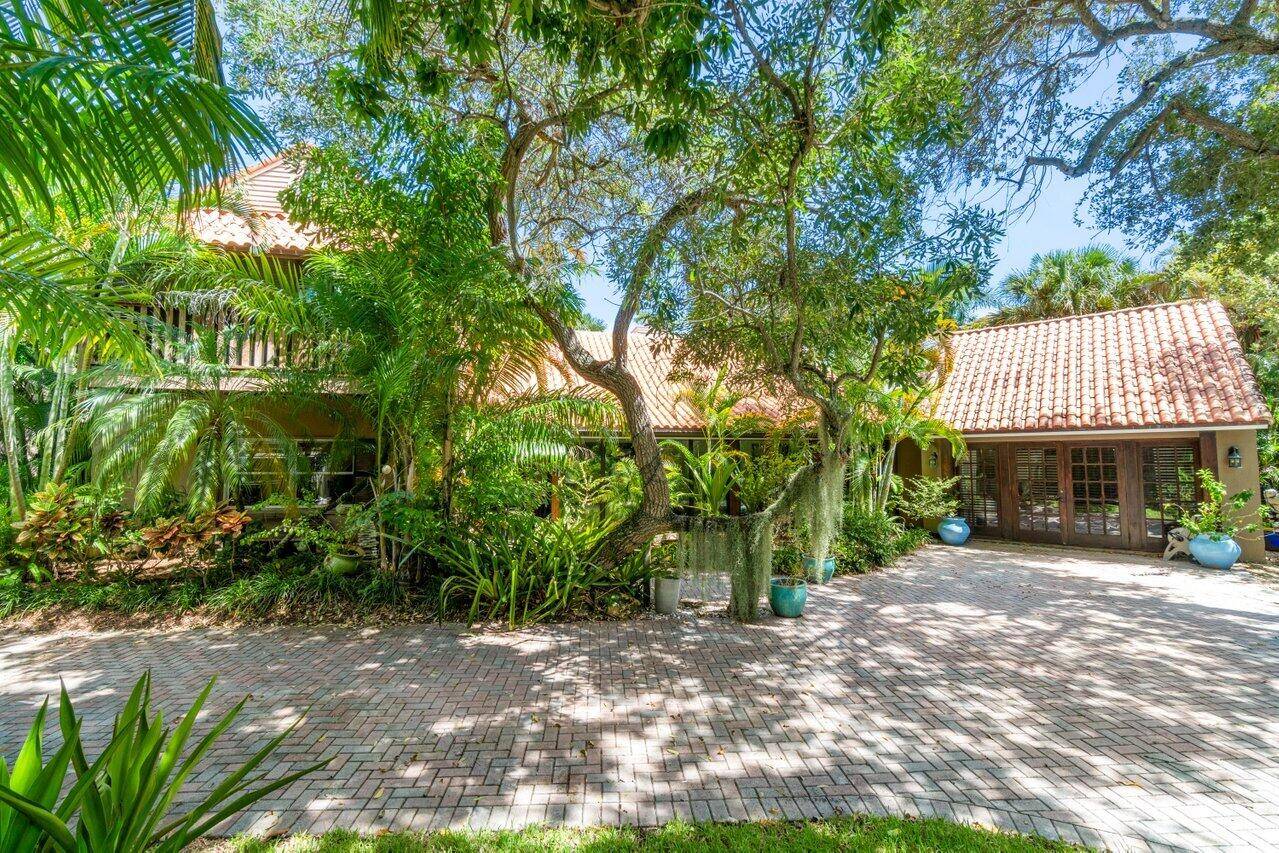 Discover the tropical bliss of living on Hypoluxo Island in this stunning 4 bed 3 bath main house with a separate 1 bed 1 bath guest house, offering 4, 827 ...
