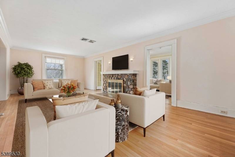 Classic 1934 center hall Colonial set on a rare 0.