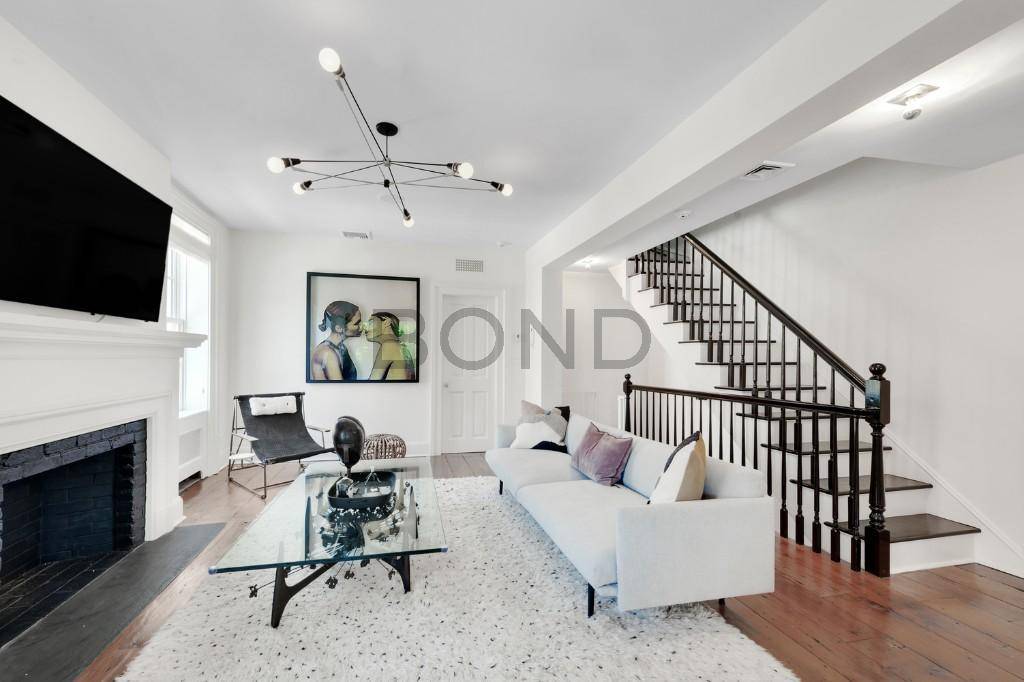 Completed in 1837, this meticulously renovated, landmarked Federal style townhouse is perched on a quintessential corner in the heart of the West Village.
