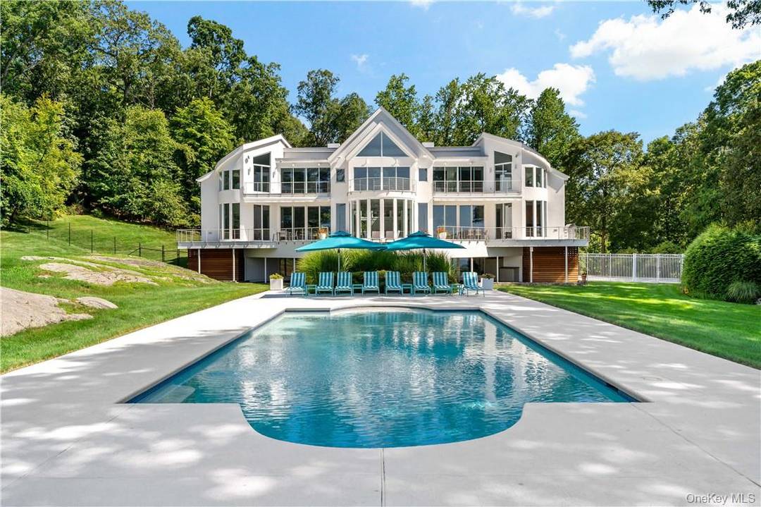 Discover Domain Serene, a rare architectural masterpiece perched high above the Hudson River.