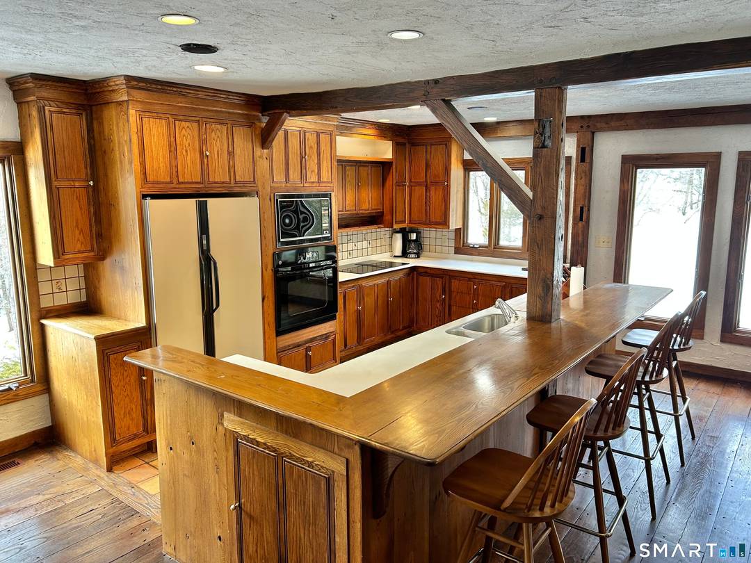 Country Living Abounds with this unique custom built one of a kind Cape nestled on 5 secluded acres.