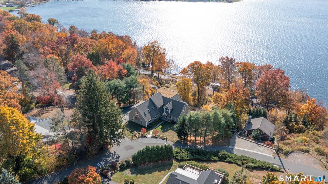 This stunning, private, lake club home offers incredible views of Candlewood Lake, featuring picturesque western exposure with breathtaking sunsets.