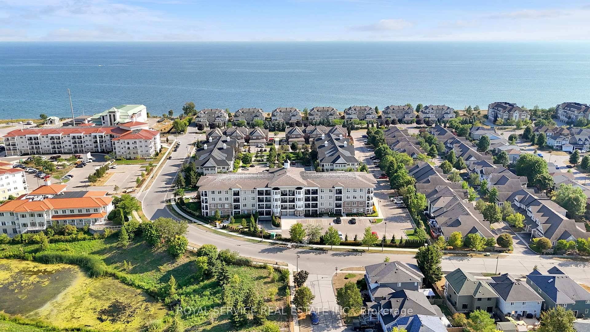 Wake up to the beauty of lakeside living in this rare top floor corner suite, where every glance out the window feels like a postcard.