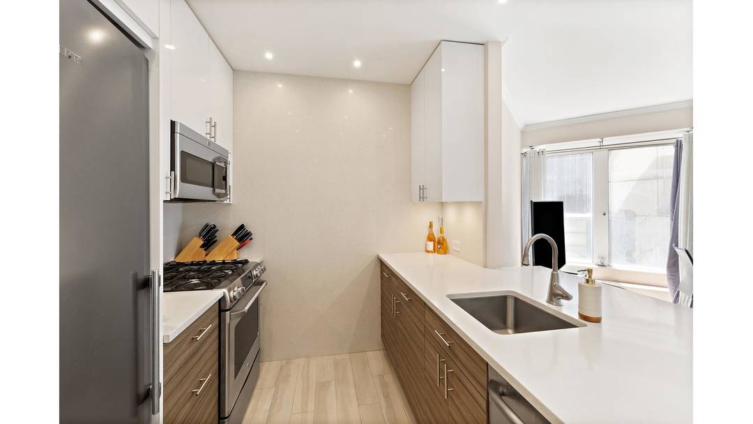 This stunning one bedroom and one and a half bathroom condo with a private balcony is being offered at the CitySpire building in Midtown West.