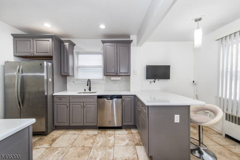 Welcome to this beautifully renovated 4 bedroom, 2 bath home located in a highly desirable section of East Orange, bordering Bloomfield.