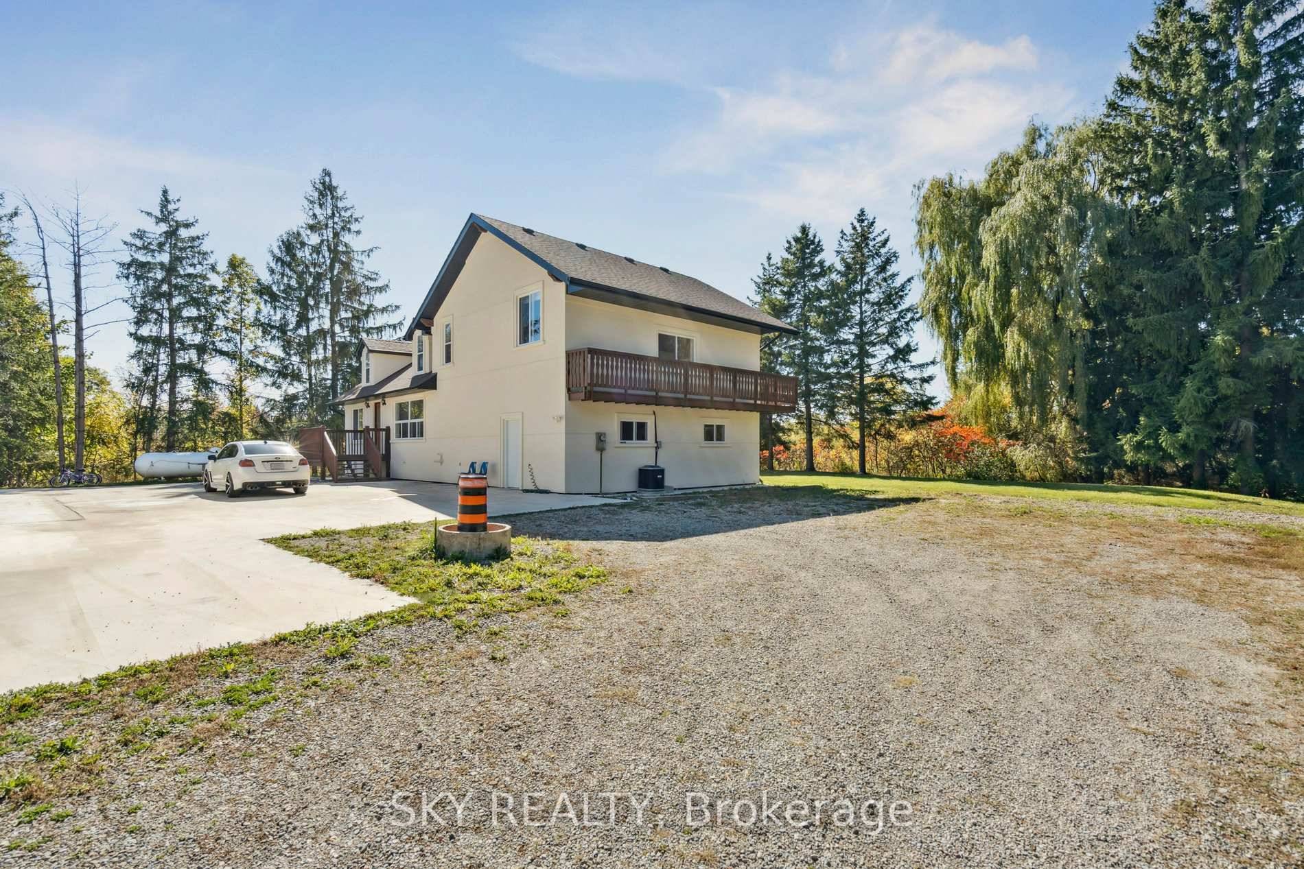 Unique 1 acre property featuring a Renovated 3 bedroom house and freestanding 9000 sq ft Commercial industrial Building with a 2 Legal bedroom unit above the warehouse.