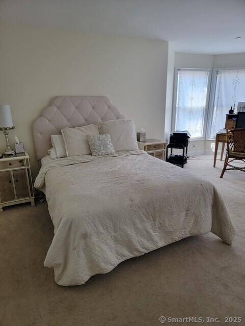 Welcome to this rare and sought after end unit townhouse in the charming Wisteria Gardens enclave, nestled just steps from the vibrant heart of downtown Ridgefield.