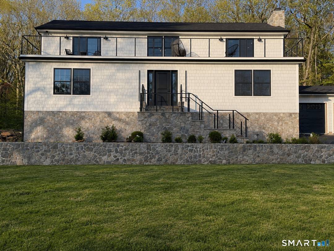 This brand new renovation offers turnkey living in a highly sought after setting perched at the highest point above prestigious Lake Waramaug.