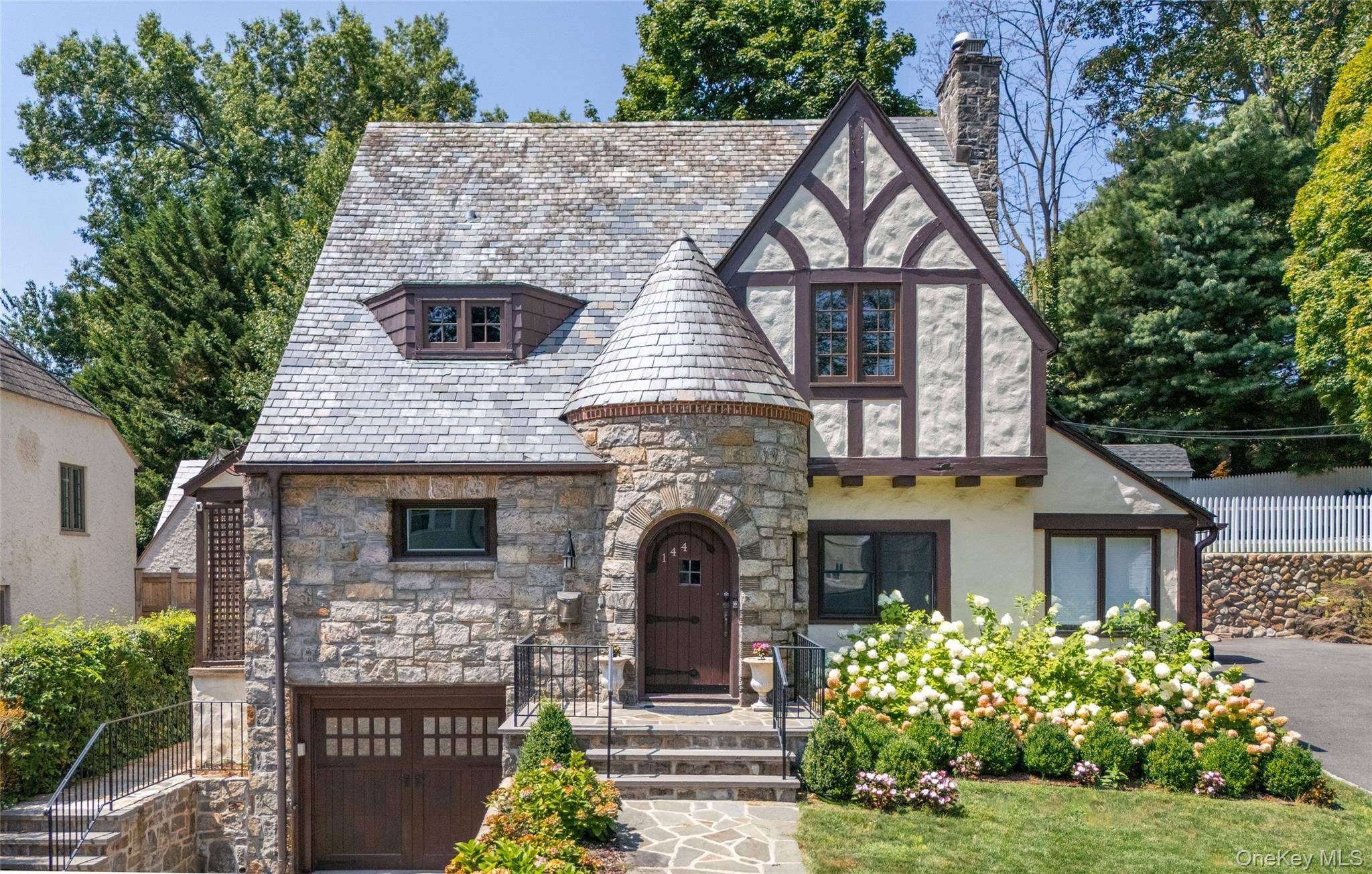 Stunning 1930s Stone Tudor in the Highly Sought After Aubyn Manor Hunts Woods Park area.