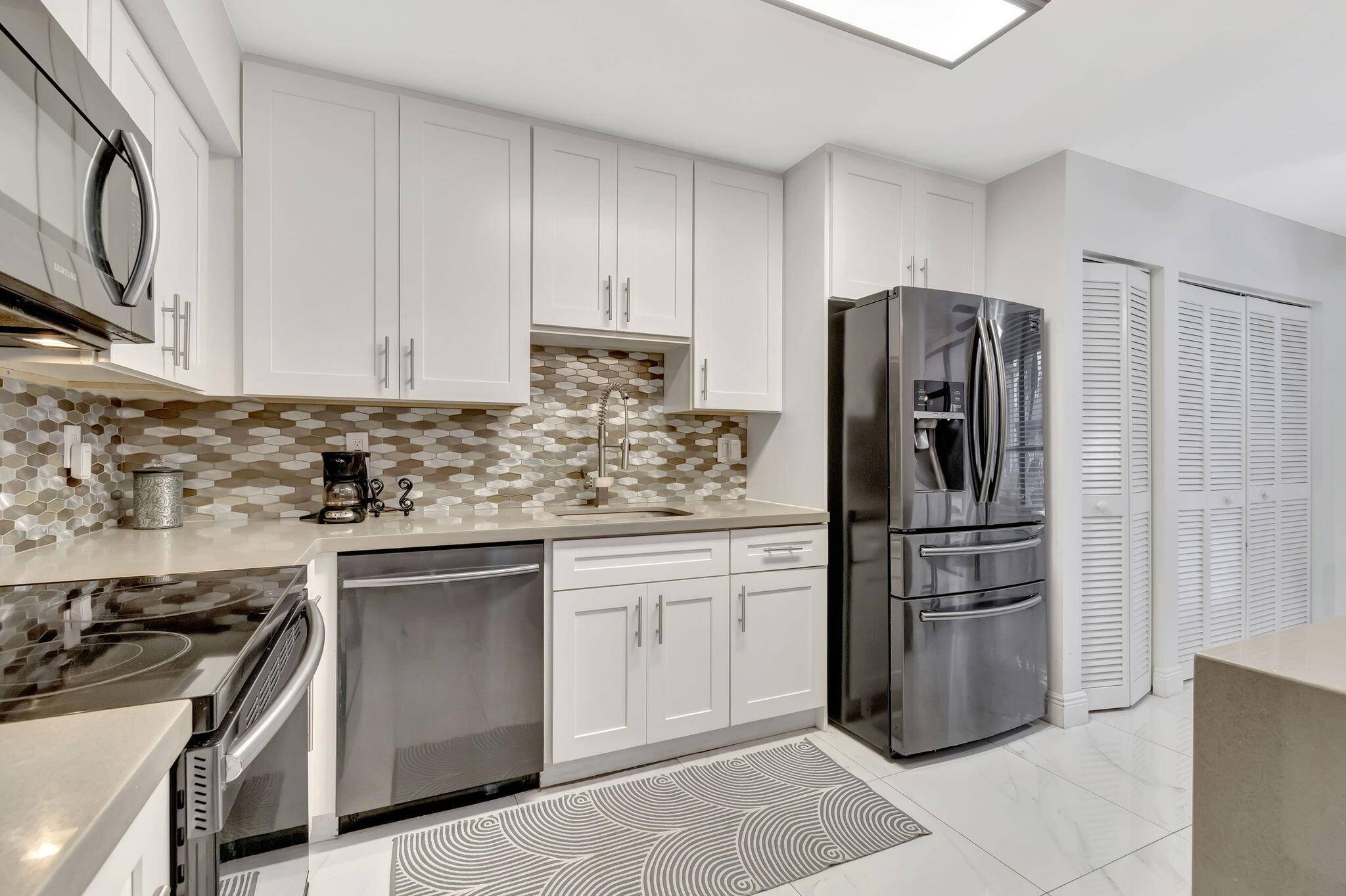 NEW AC just replaced in this Updated First Floor Condo in Regency at Boca Pointe 3 Bed, 2.