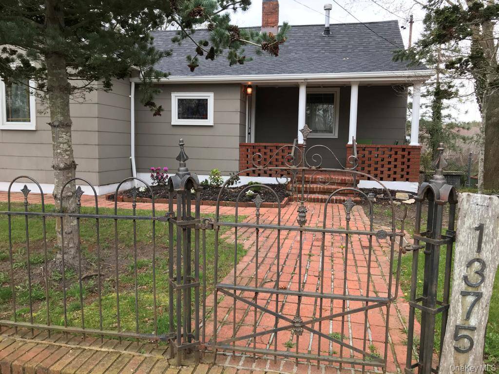 Updated waterfront cottage with dock on the Peconic River, ideally located on West Main Street in Riverhead and offering a strong rental history.