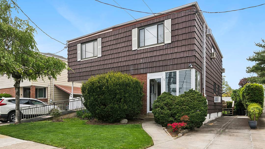 Welcome to this well maintained semi attached home, beautifully set on a quiet, tree lined street in the heart of Kew Gardens Hills.