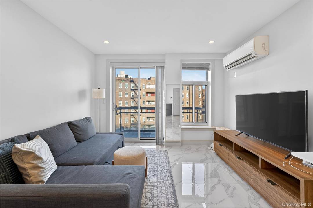 Welcome to modern living in the heart of Rego Park.