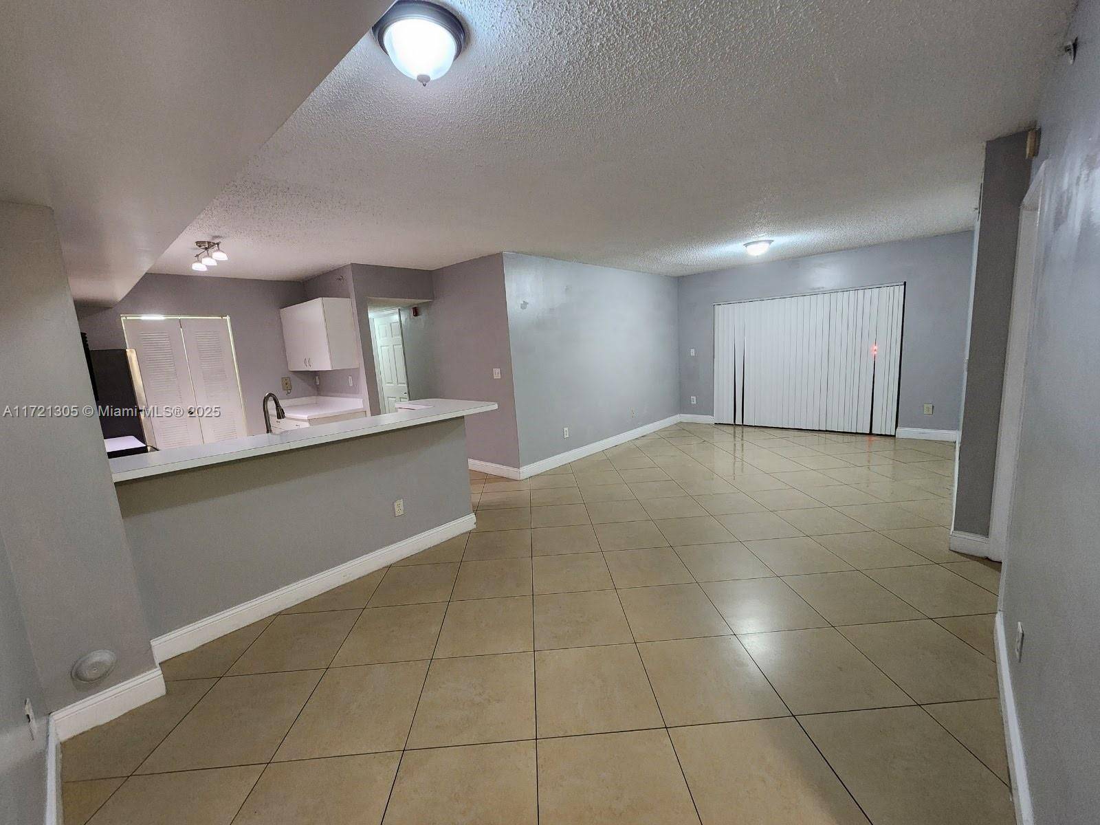 This 3 2 unit in the Royal Grand Condominium is ideally situated on the first floor of the complex.