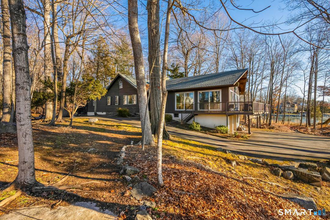 Charming waterfront log cabin offering 3 bedrooms and 2 full baths in a private, serene neighborhood.