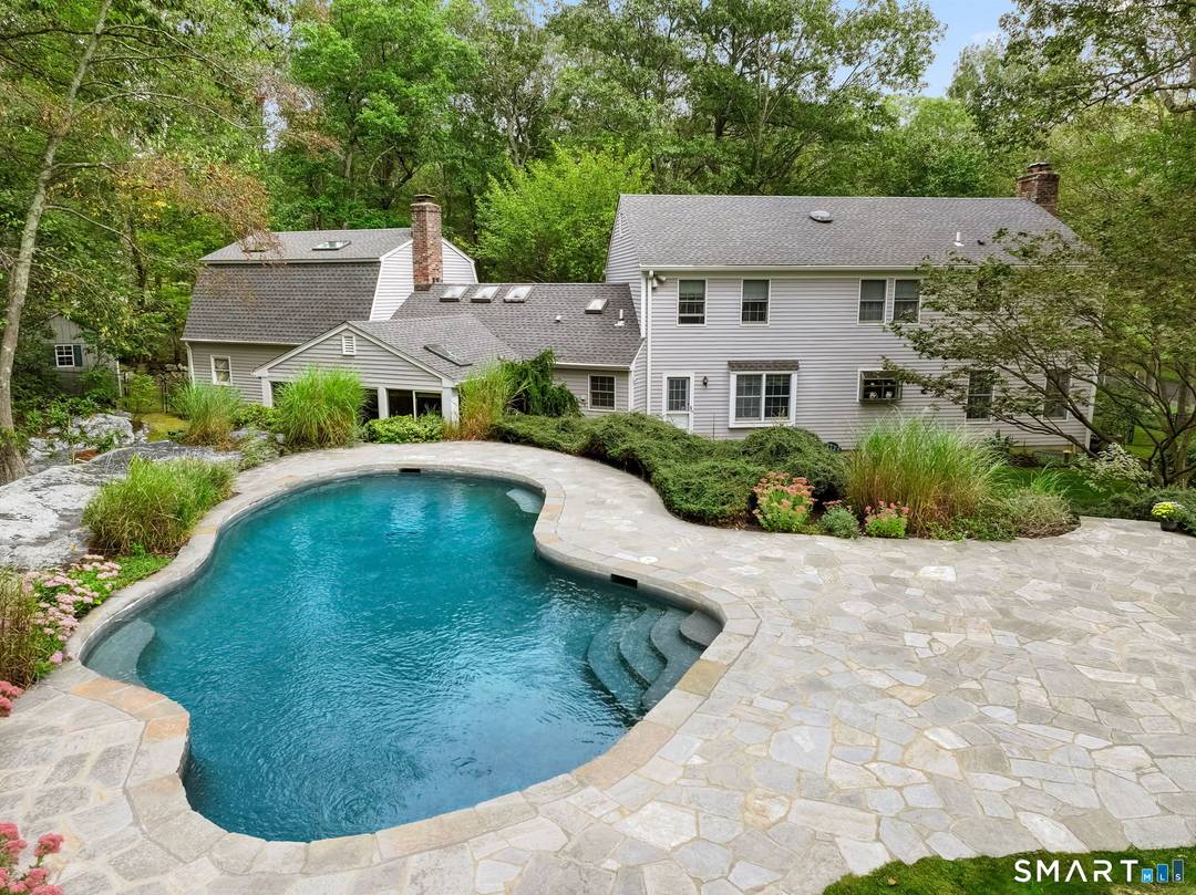 Ideally situated in southern Wilton near the New Canaan border, this beautifully appointed four bedroom, 2.