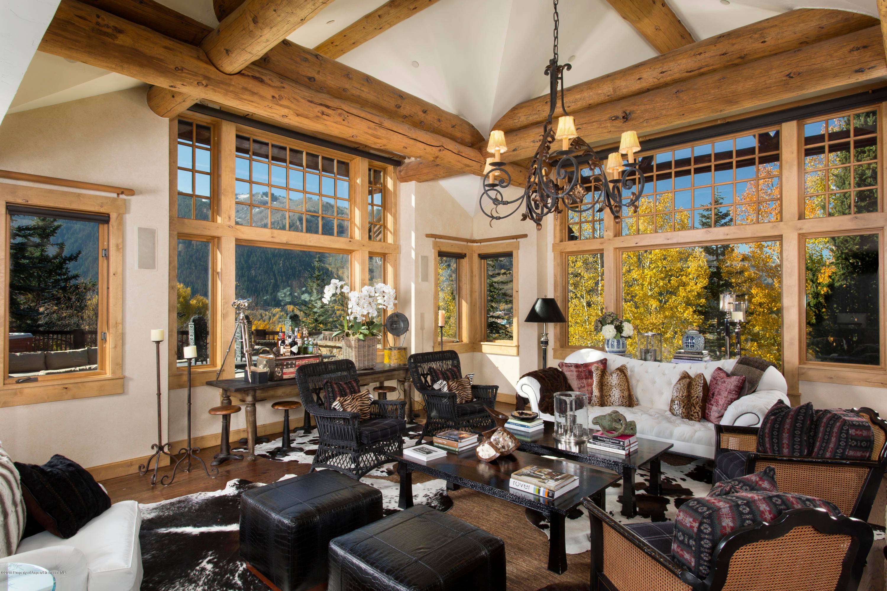 This three level, 5 bedroom, 5 1 2 bath Silverlode residence at the base of Smuggler Mountain has it all.