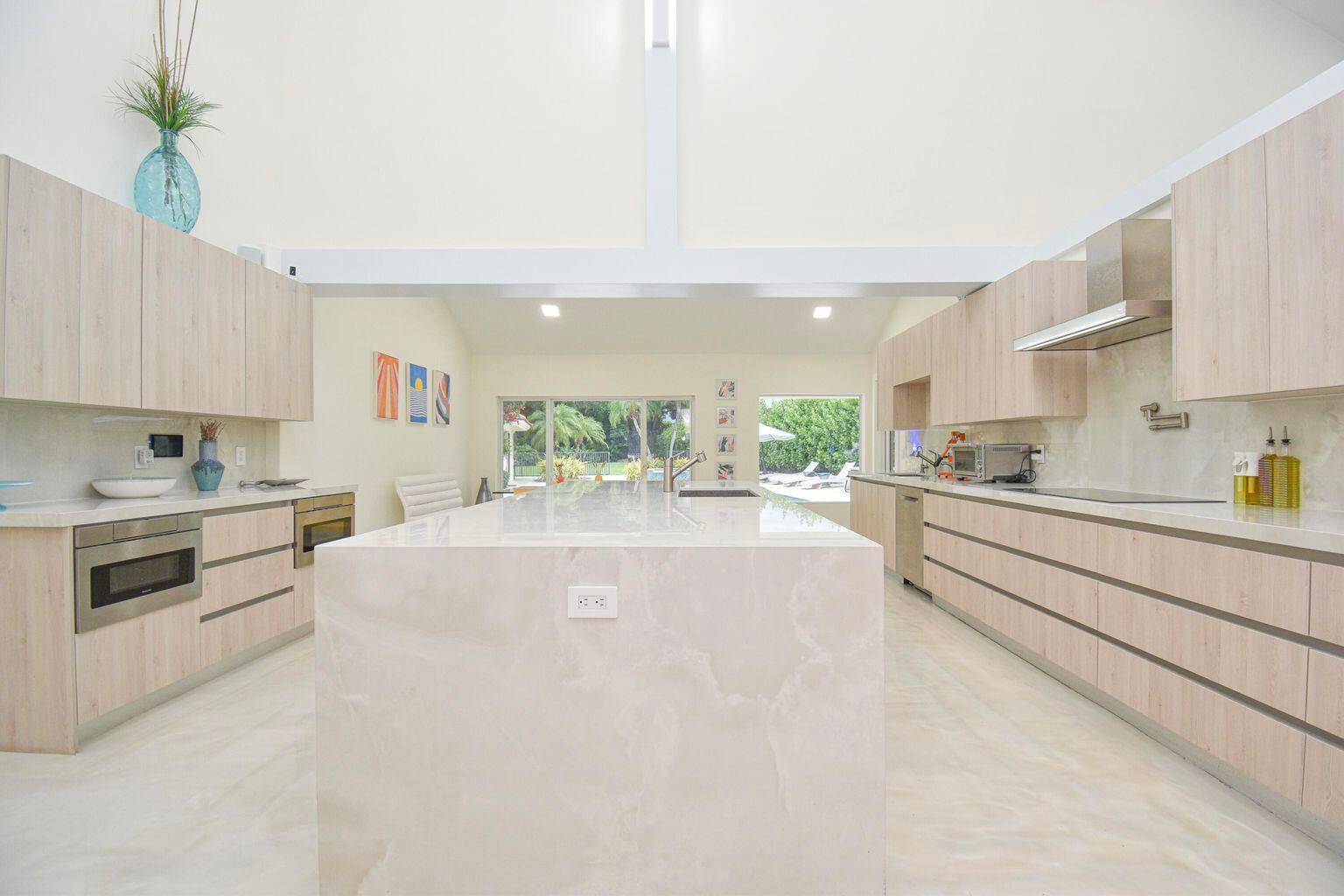 Come spend your time in this resort style oasis with 20 ft ceilings, open space, lots of natural light with a modern coastal vibe you can make your own !