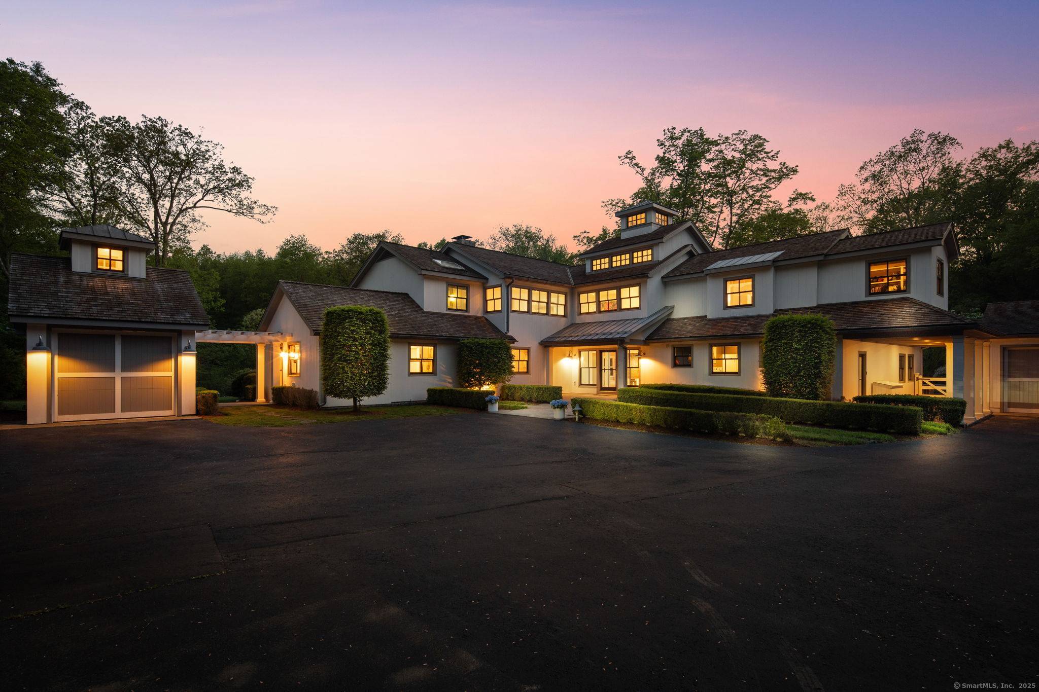California meets New Canaan in this William Wurster inspired transitional style masterpiece set on 2.