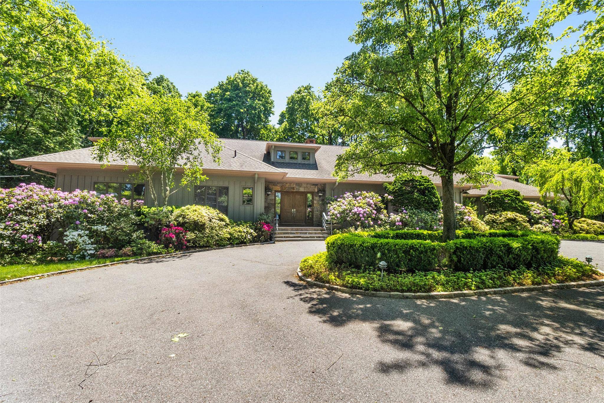 Welcome to a meticulously maintained, architecturally striking contemporary residence nestled in one of Harrison s most sought after neighborhoods.