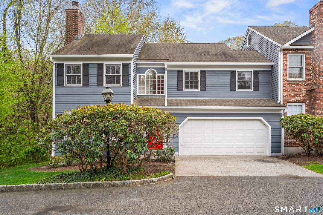 A fully remodeled end unit townhouse offering a contemporary and inviting living space, featuring three spacious bedrooms and 2.