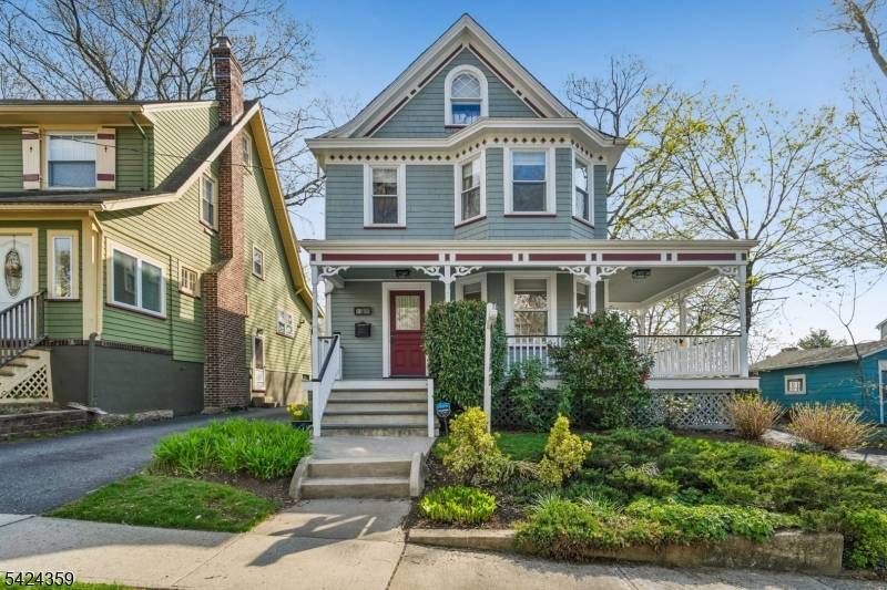 The welcoming front porch sets the tone for this warm and inviting four bedroom, two full and two half bath Victorian home, filled with natural light throughout.
