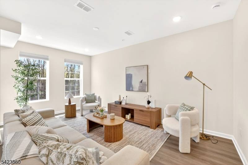 New Construction Excellence at The Hills at Warren Ideally situated just 12 minutes from the Summit Train Station, this elegant, brand new construction townhouse is a must see.