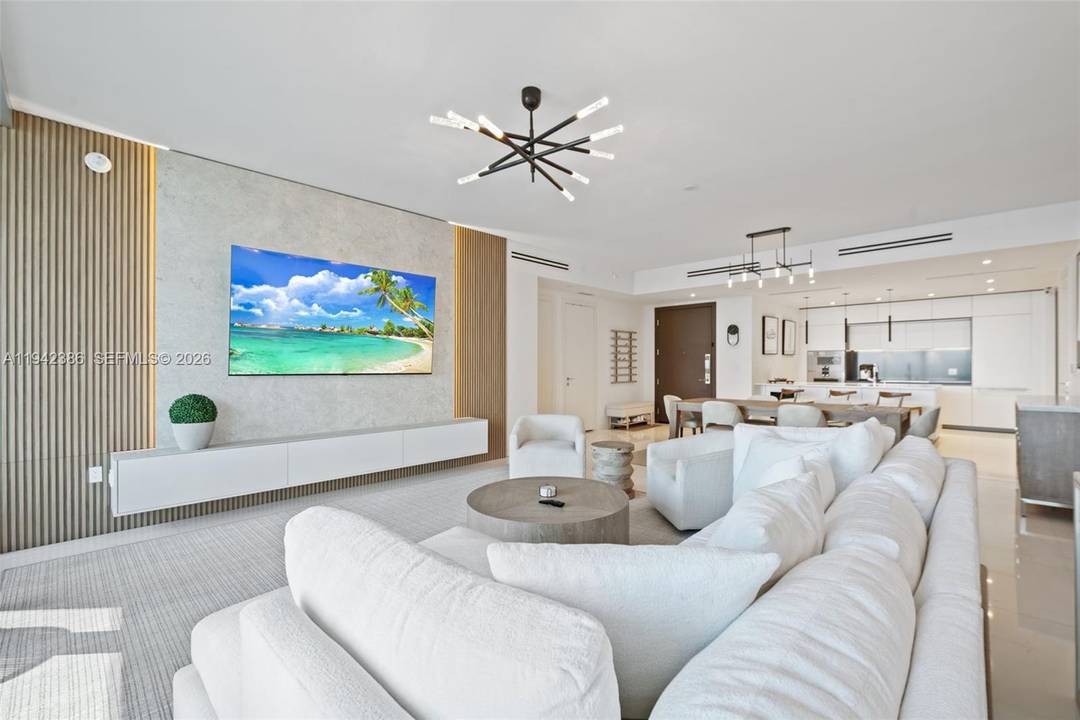 Move in ready waterfront residence at Aston Martin Residences featuring 2 bedrooms plus a convertible den with a built in Murphy bed and 3 full bathrooms.