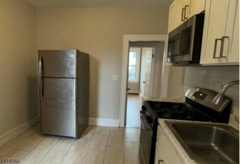 Welcome to this newly listed 4 family solid brick property nestled in the heart of Newark's desirable Weequahic neighborhood.