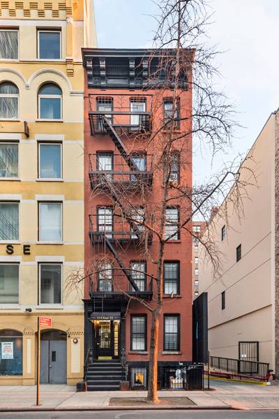 This five story walk up building contains six one bedroom apartments and two two bedroom units.