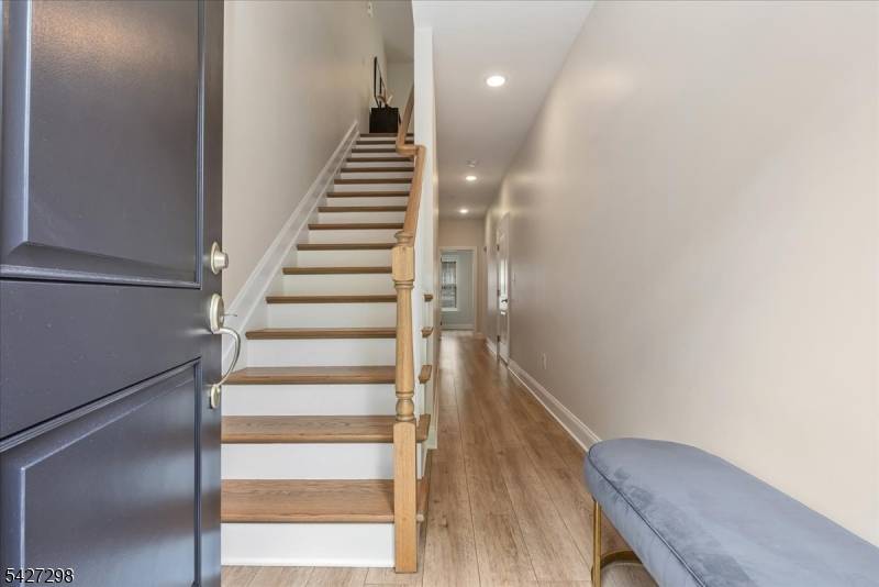 Welcome to 102 Abbe Road in Little Falls, a stylish and sophisticated townhome offering 3 levels of modern living designed for today's lifestyle.